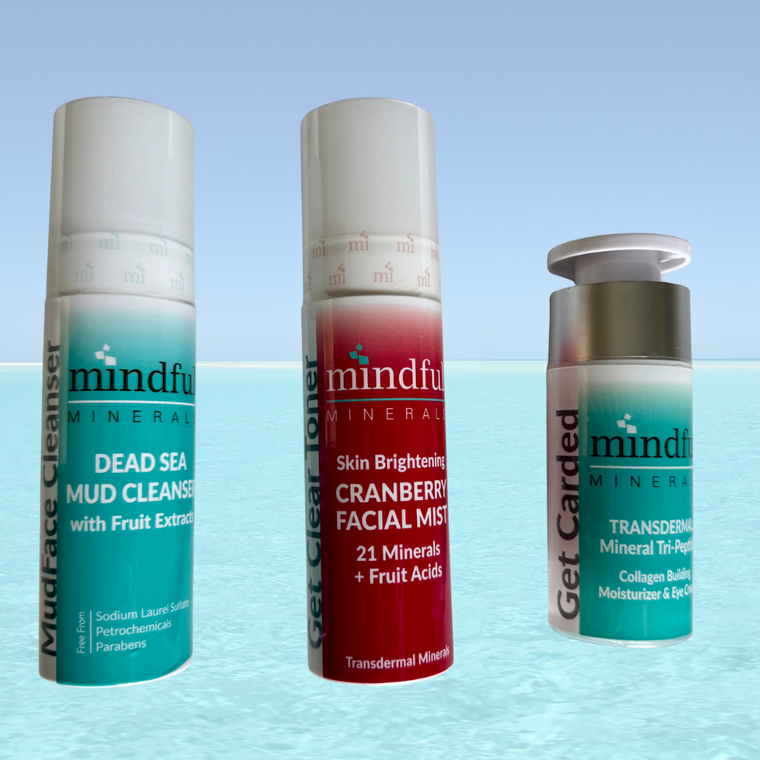 Three skincare products from the brand 'mindful' on a light blue gradient background.